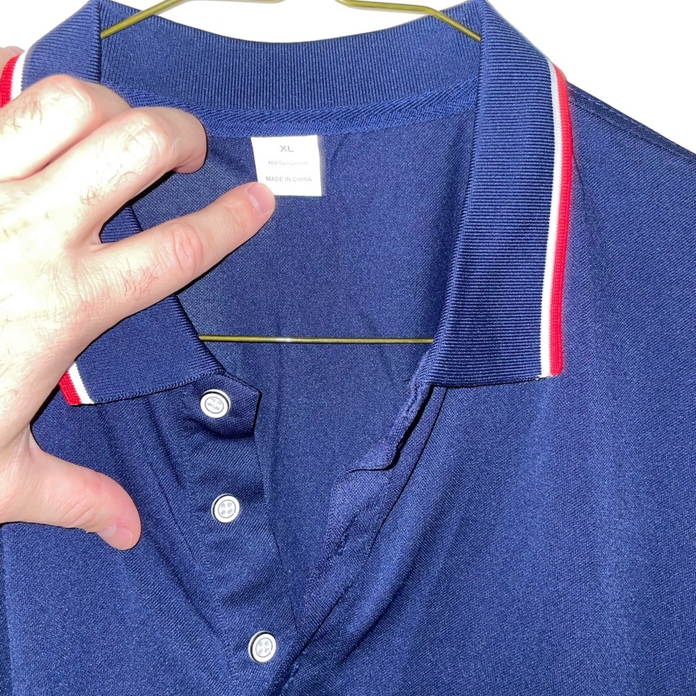 Navy polo with red trim, 100% polyester ￼